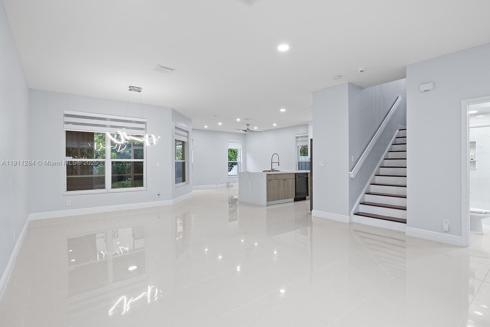 16296 Southwest 26th Street Miramar, FL 33027 - Photo 8 of 48 a view of an empty room with stairs