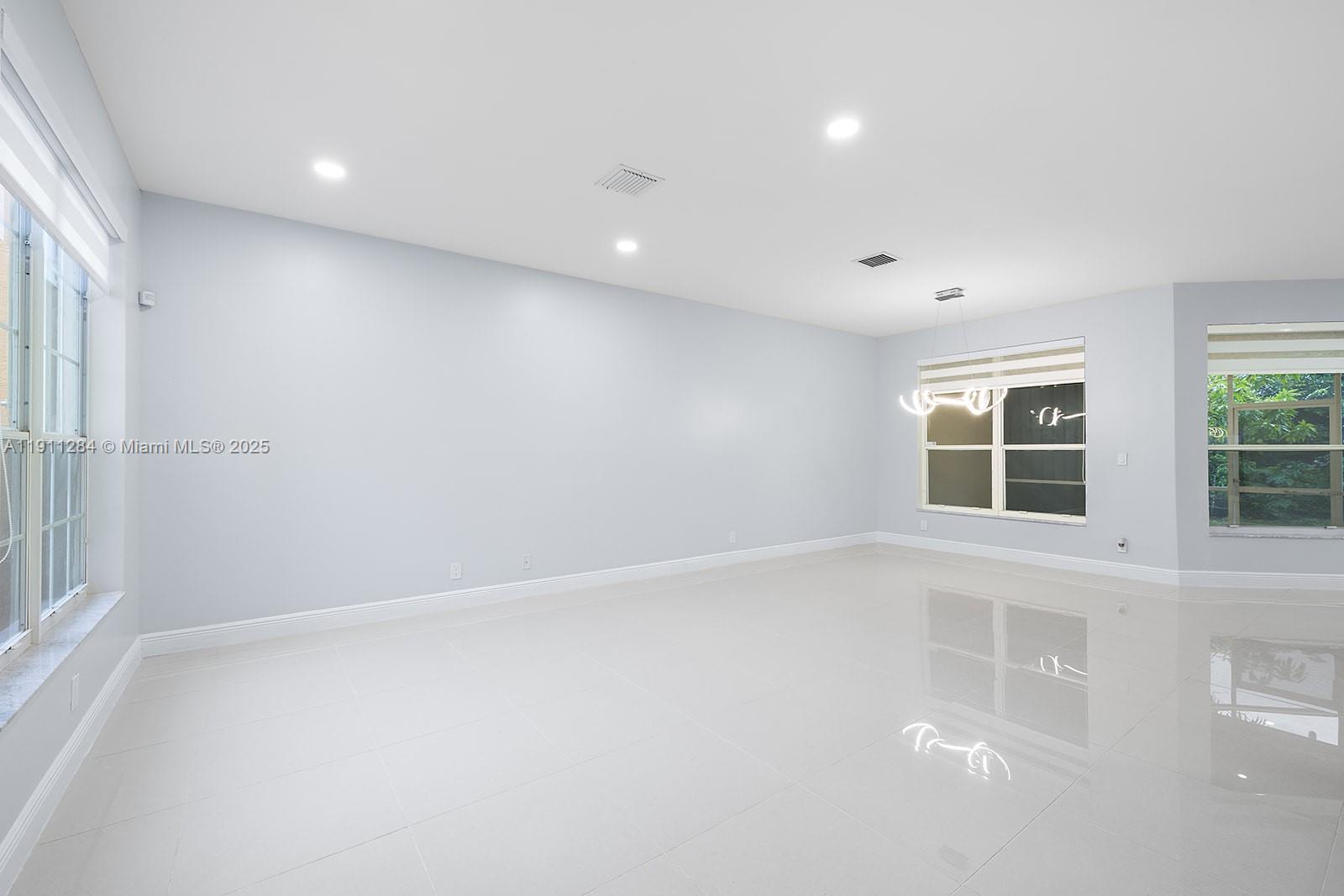 16296 Southwest 26th Street Miramar, FL 33027 - Photo 9 of 48 an empty room with windows