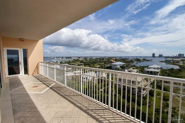 a view of a balcony with wooden floor