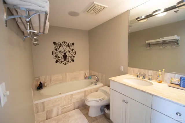 a bathroom with a sink a toilet and a bathtub