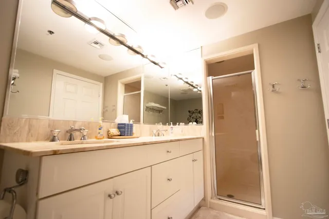 a bathroom with a sink and mirror