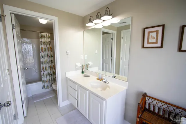 a bathroom with a sink a mirror and a shower