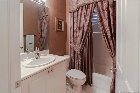 a sign broad in front of flowers