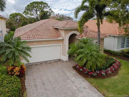 an aerial view of a houses with outdoor space and lake view
