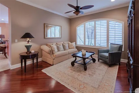 a view of a dining room with furniture wooden floor and a chandelier