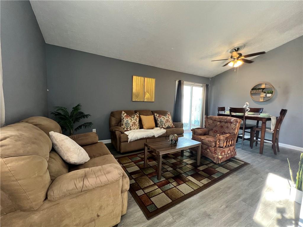1496 Pine Log Road Northeast, Unit A Conyers, GA 30012 - Photo 13 of 24 a living room with furniture rug and window