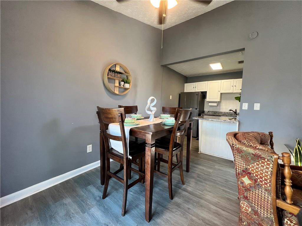 1496 Pine Log Road Northeast, Unit A Conyers, GA 30012 - Photo 16 of 24 a dining room with furniture and window