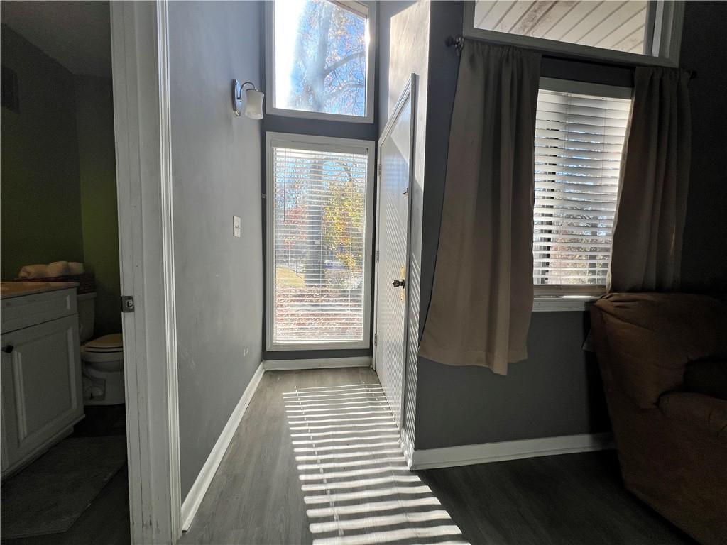 1496 Pine Log Road Northeast, Unit A Conyers, GA 30012 - Photo 3 of 24 a view of a bedroom from the hallway