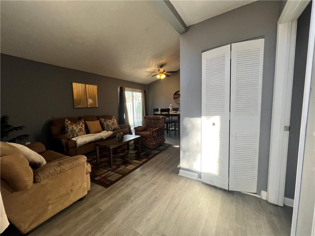 1496 Pine Log Road Northeast, Unit A Conyers, GA 30012 - Photo 4 of 24 a living room with furniture and a flat screen tv