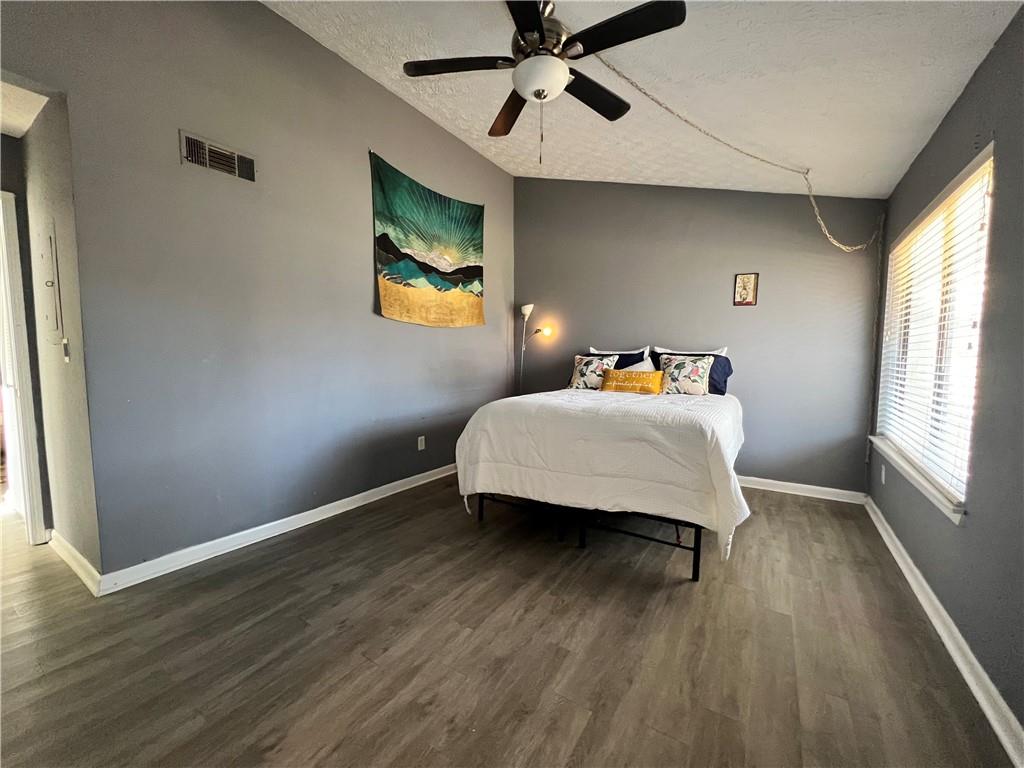 1496 Pine Log Road Northeast, Unit A Conyers, GA 30012 - Photo 9 of 24 a bedroom with bed and window