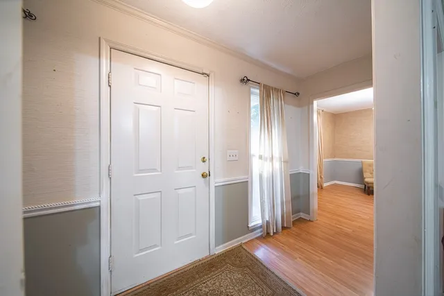 a view of a room that has a bed in it