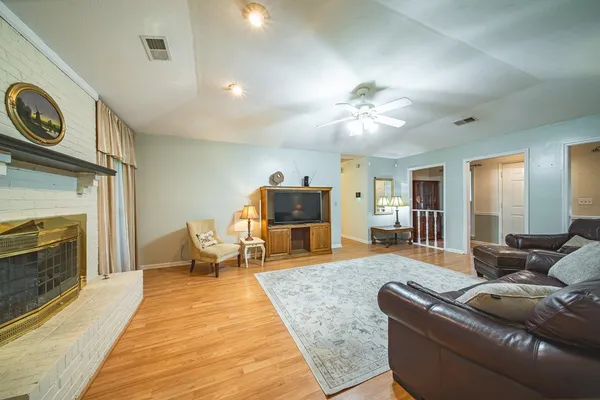 a living room with furniture and a fireplace