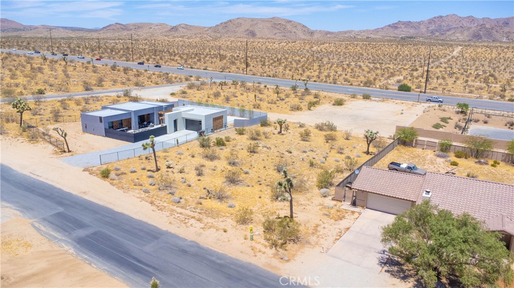 60812 Division Street Joshua Tree, CA 92252 - Photo 3 of 9 an aerial view of residential houses with outdoor space and ocean view