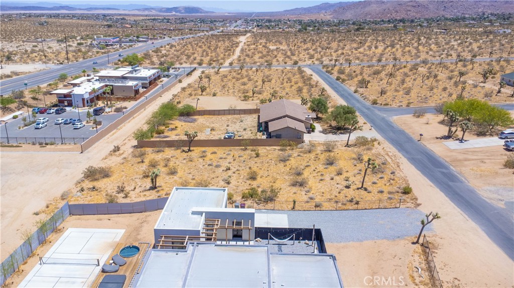 60812 Division Street Joshua Tree, CA 92252 - Photo 6 of 9 an aerial view of residential houses with outdoor space