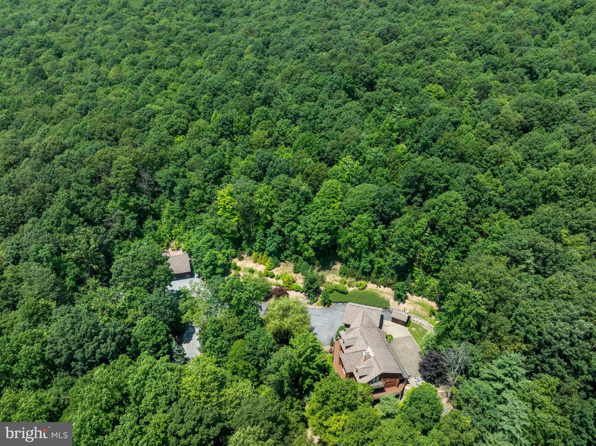 1400 Jacks Mountain Road McVeytown, PA 17051 - Photo 23 of 129 an aerial view of residential house with outdoor space and trees all around