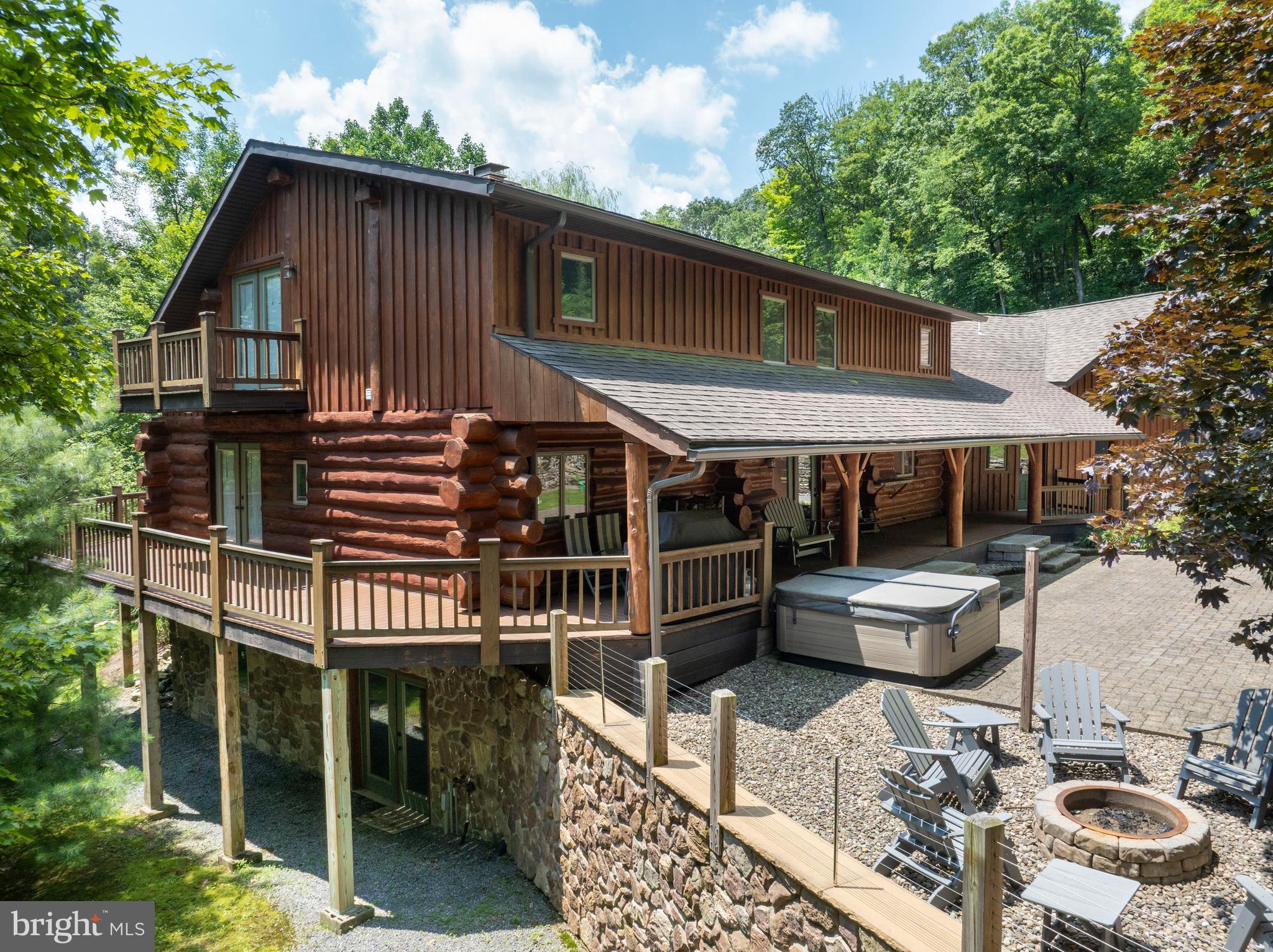 1400 Jacks Mountain Road McVeytown, PA 17051 - Photo 4 of 129 a backyard of a house with barbeque oven and outdoor seating