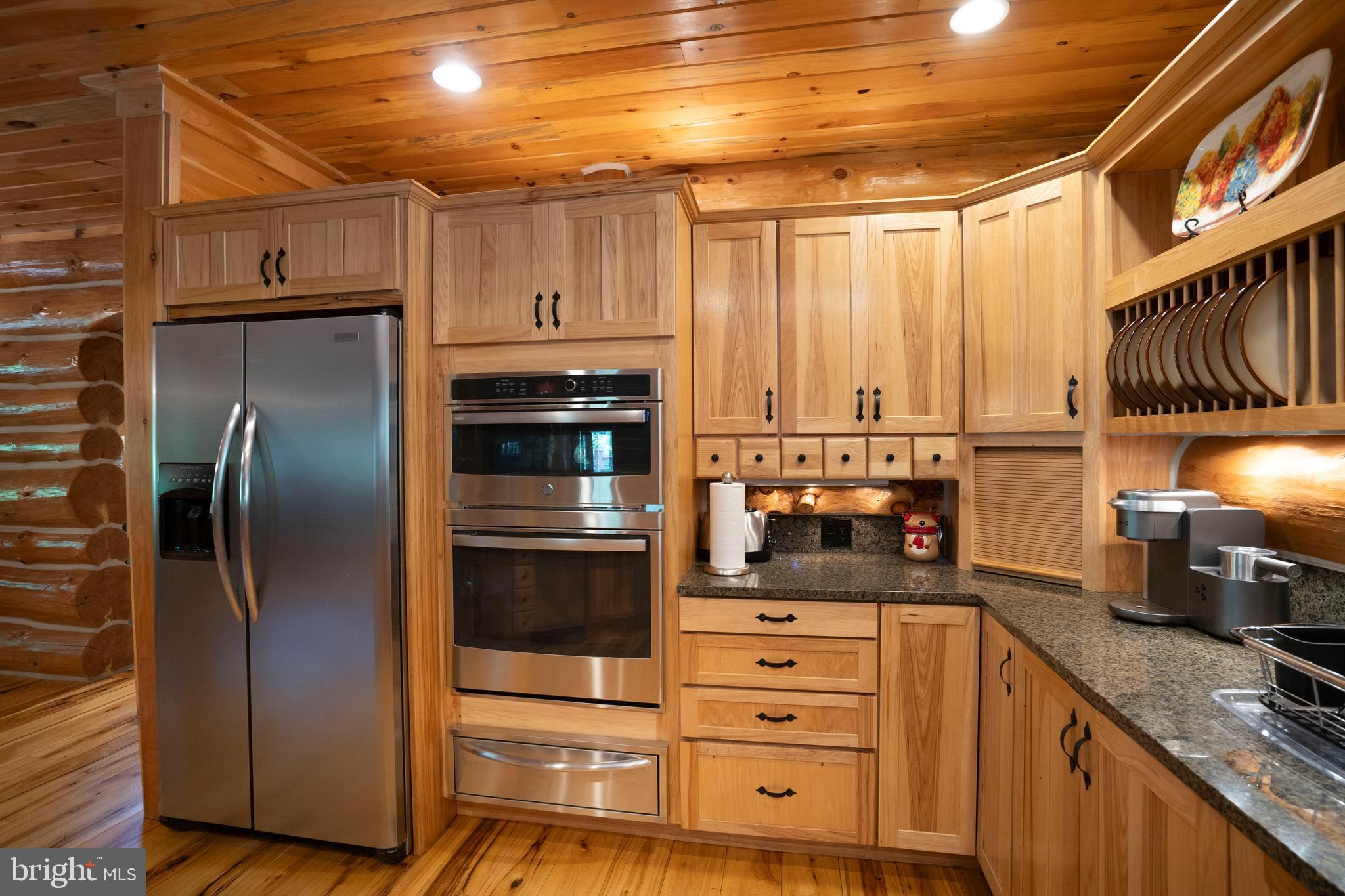 1400 Jacks Mountain Road McVeytown, PA 17051 - Photo 41 of 129 a kitchen with stainless steel appliances a refrigerator and a stove
