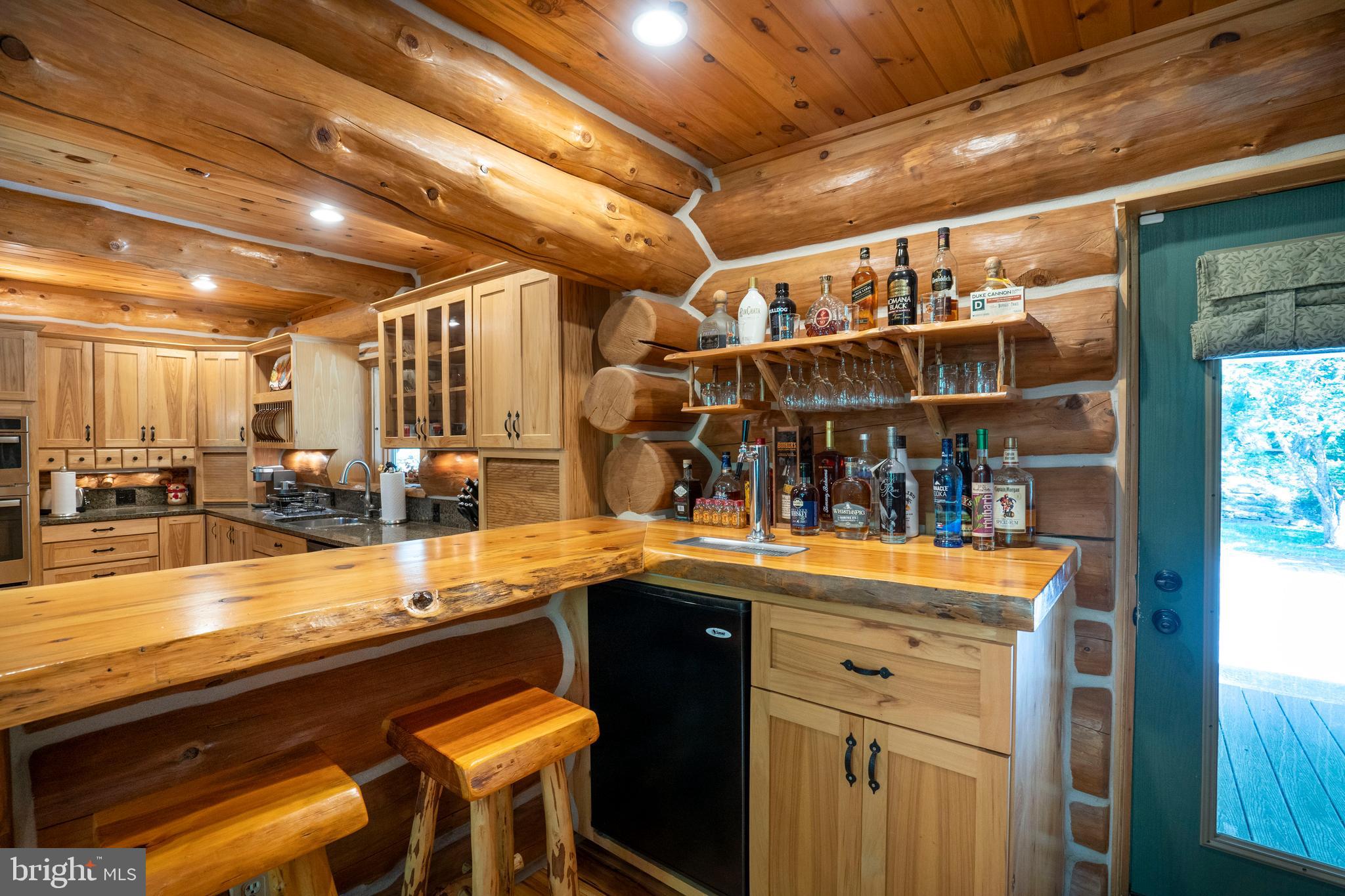 1400 Jacks Mountain Road McVeytown, PA 17051 - Photo 48 of 129 a view of a kitchen with stainless steel appliances granite countertop a sink and cabinets