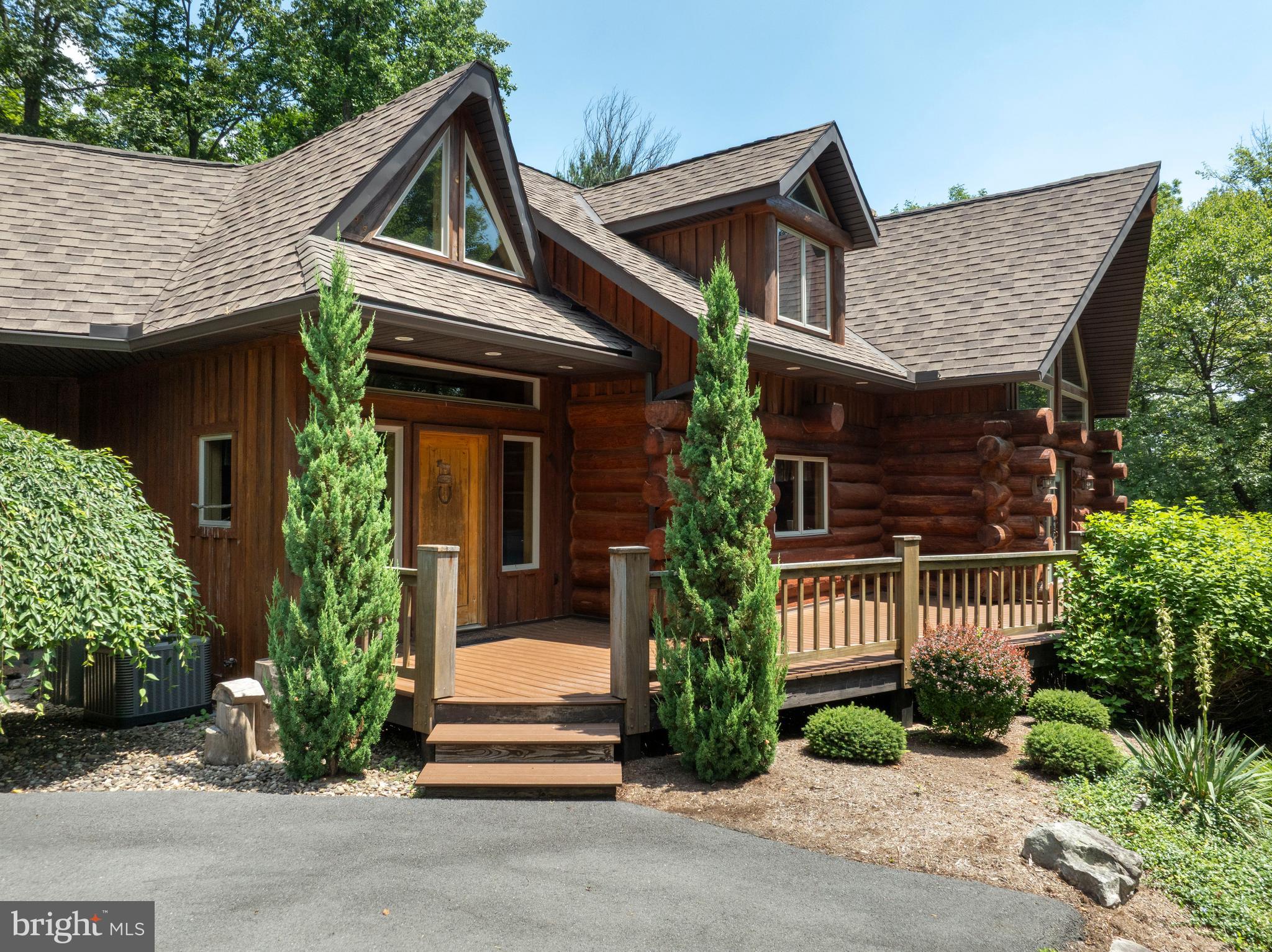 1400 Jacks Mountain Road McVeytown, PA 17051 - Photo 5 of 129 a front view of a house with garden