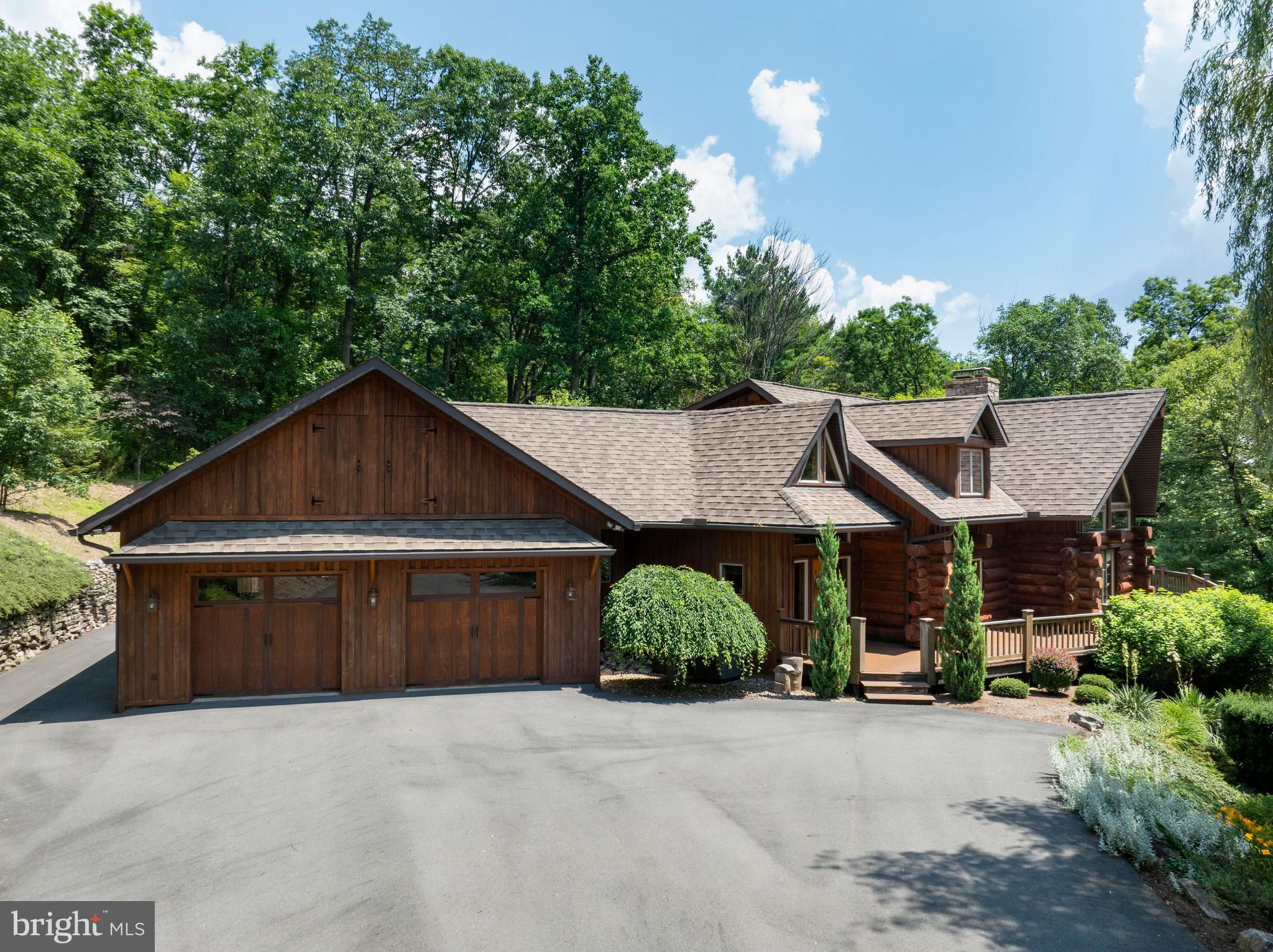 1400 Jacks Mountain Road McVeytown, PA 17051 - Photo 6 of 129 a front view of a house with a yard and garage