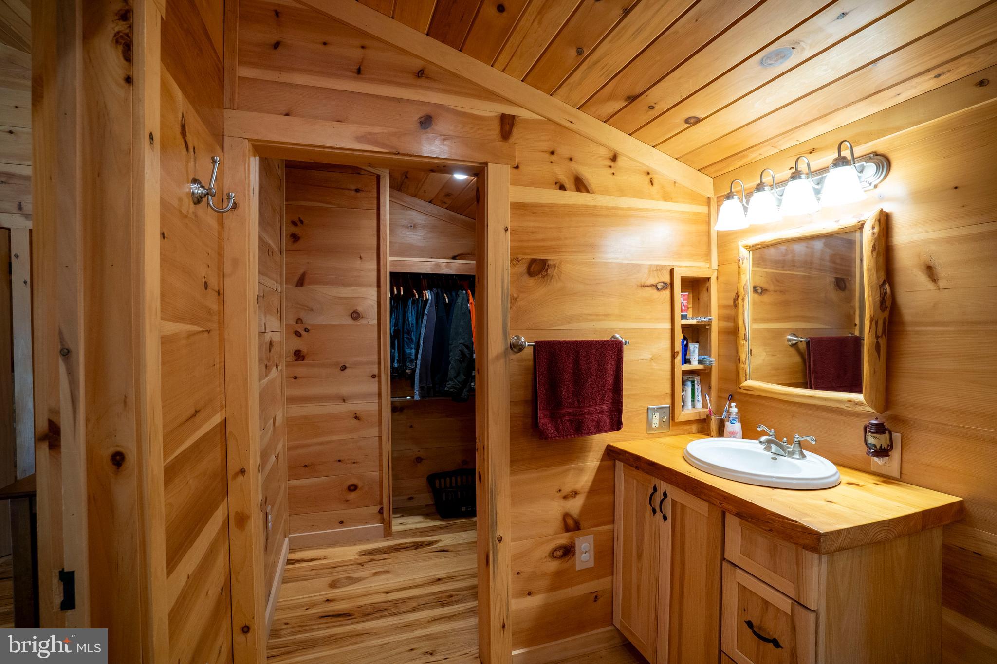 1400 Jacks Mountain Road McVeytown, PA 17051 - Photo 77 of 129 a bathroom with a sink and a mirror