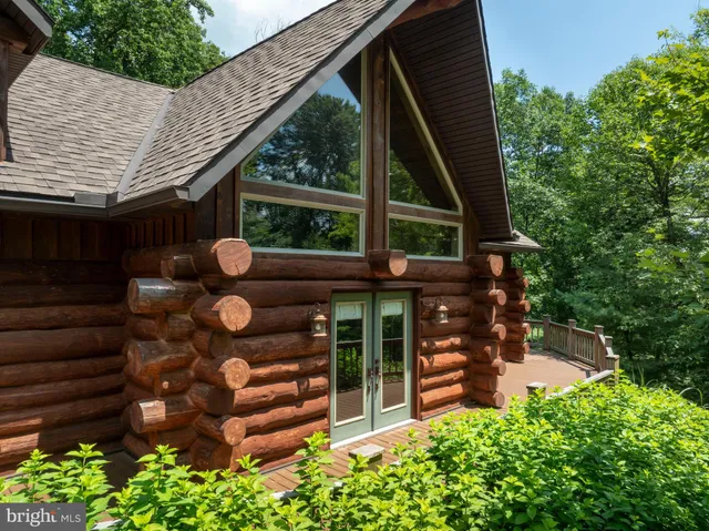 a balcony with trees in front of it