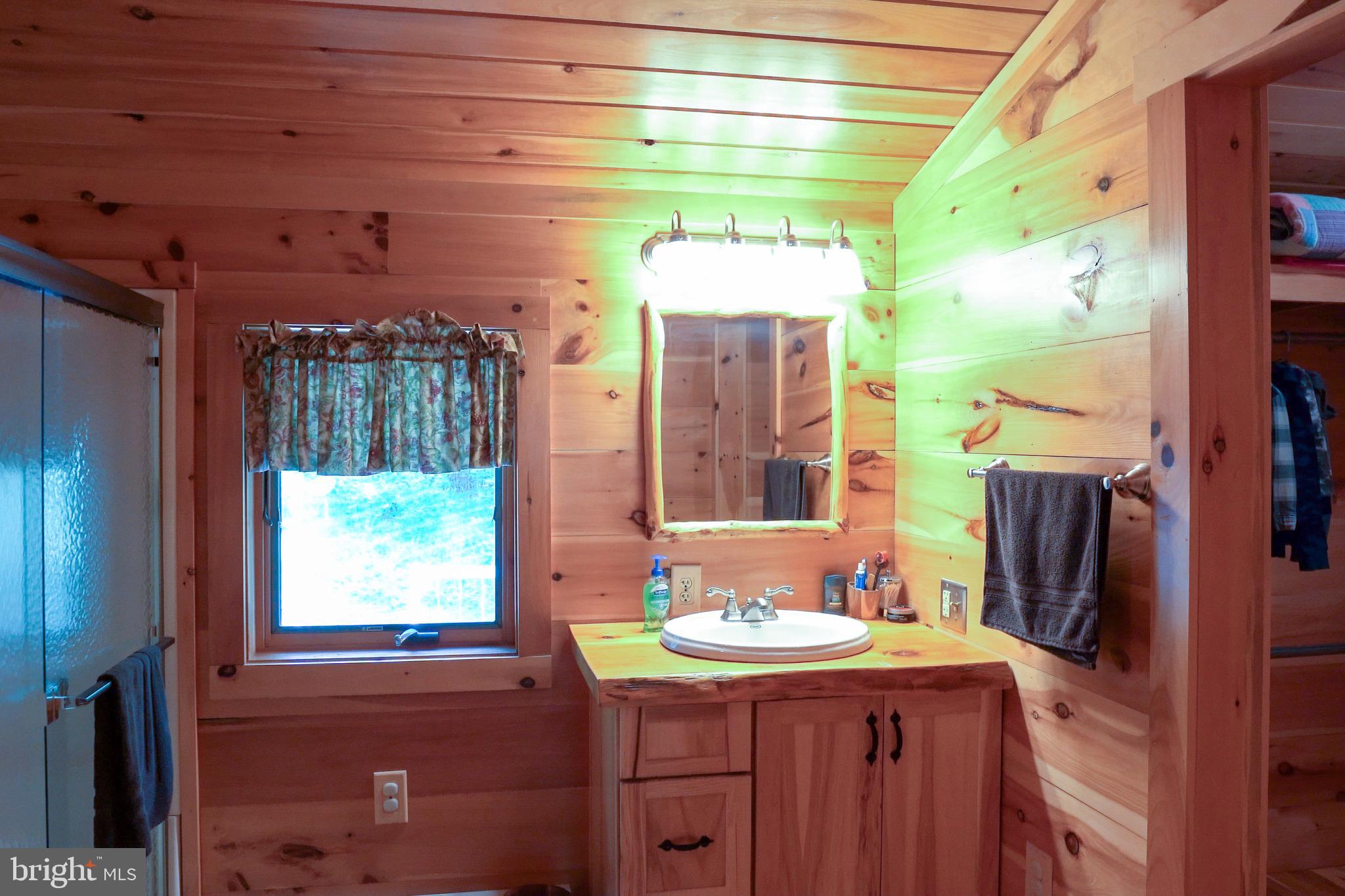 1400 Jacks Mountain Road McVeytown, PA 17051 - Photo 85 of 129 a bathroom with a sink and a mirror