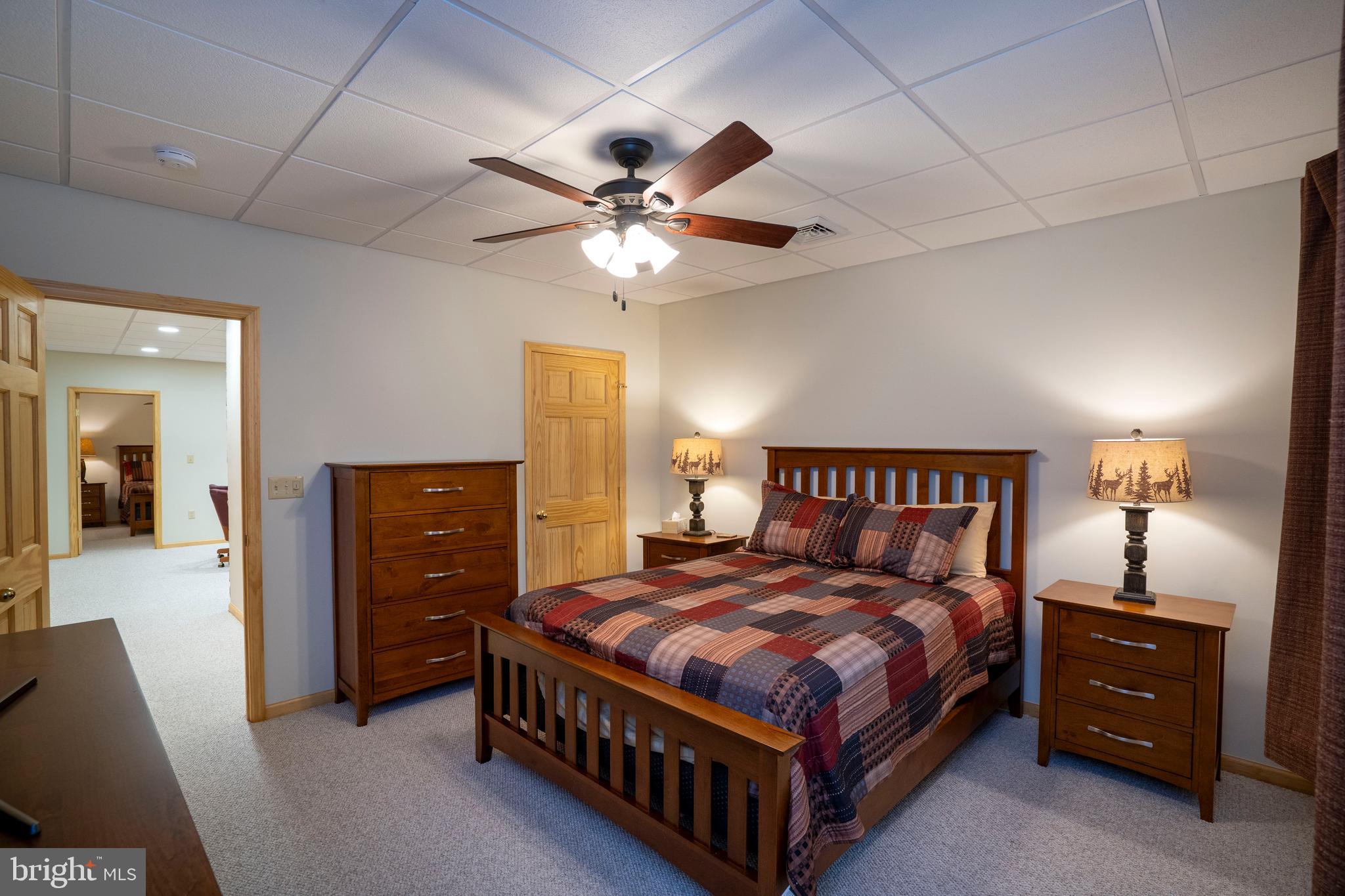 1400 Jacks Mountain Road McVeytown, PA 17051 - Photo 100 of 129 a bedroom with a bed and a chandelier