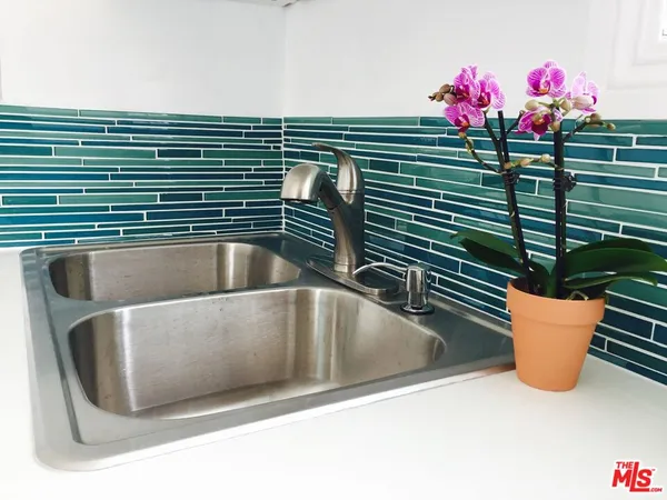 a bathroom with a sink and a window