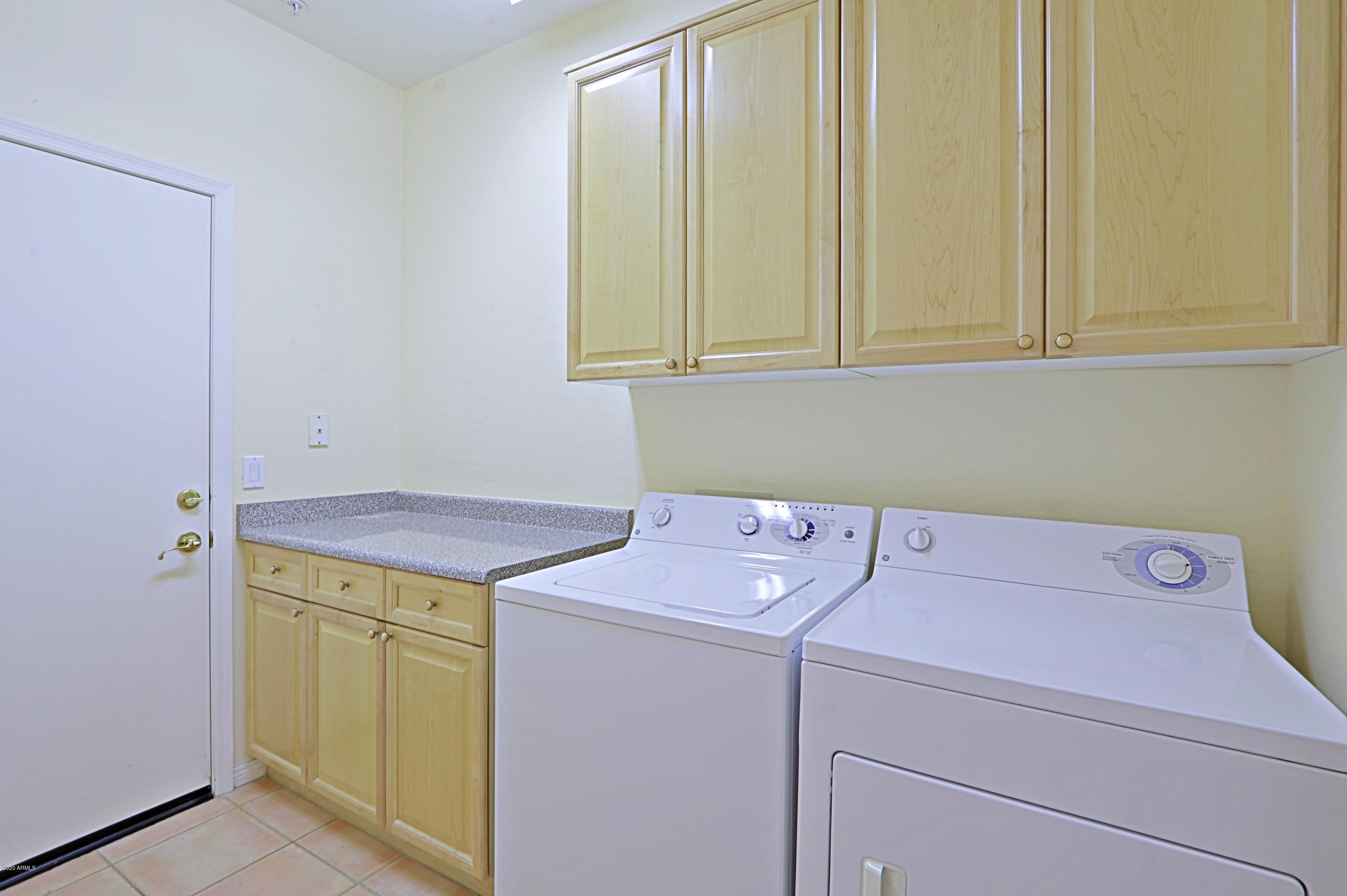 6803 East Eagle Feather Road Scottsdale, AZ 85266 - Photo 24 of 67 a utility room with dryer and washer