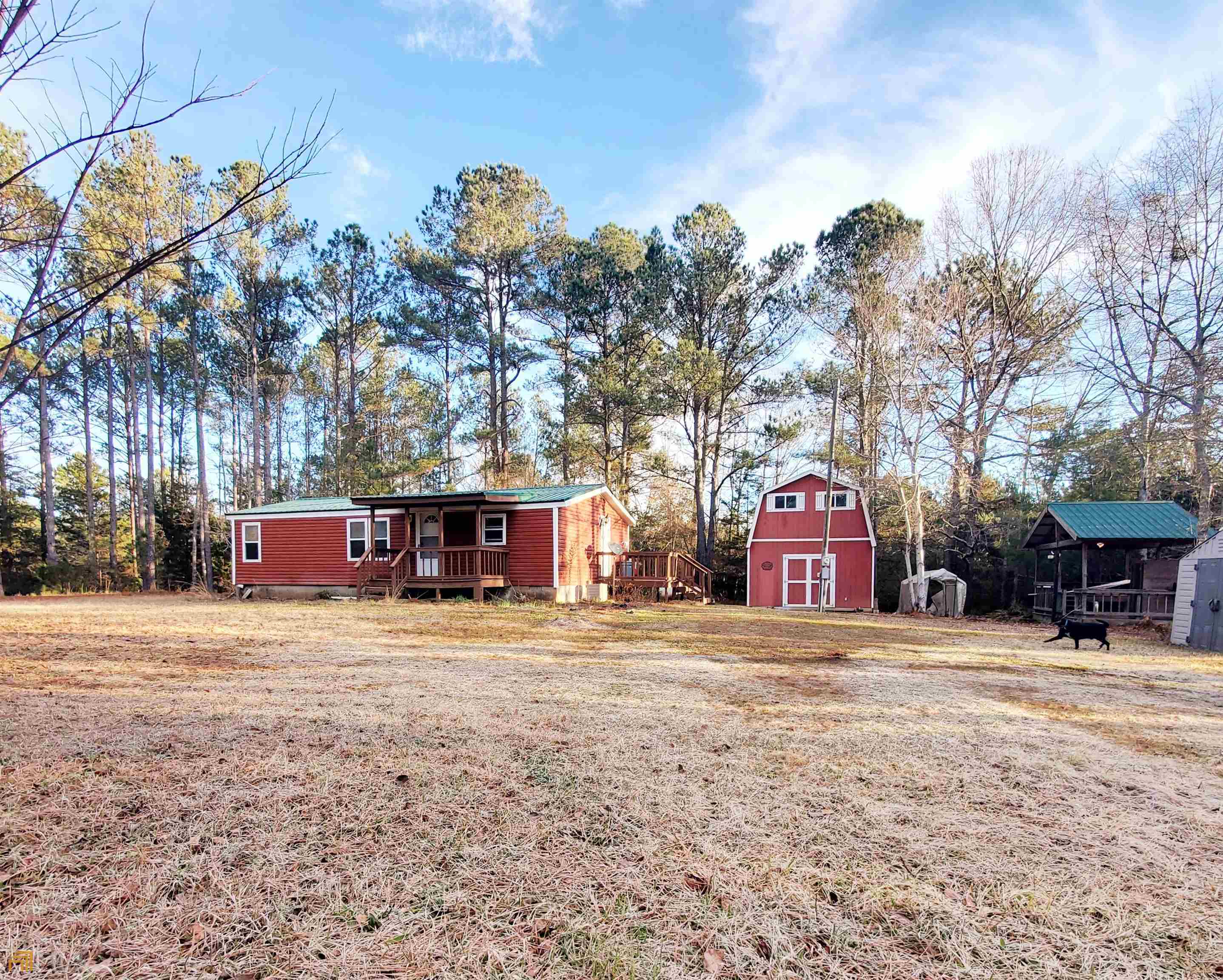 4200 Old Alabama Road Thomaston, GA 30286 - Photo 1 of 1 a house with trees in front of it