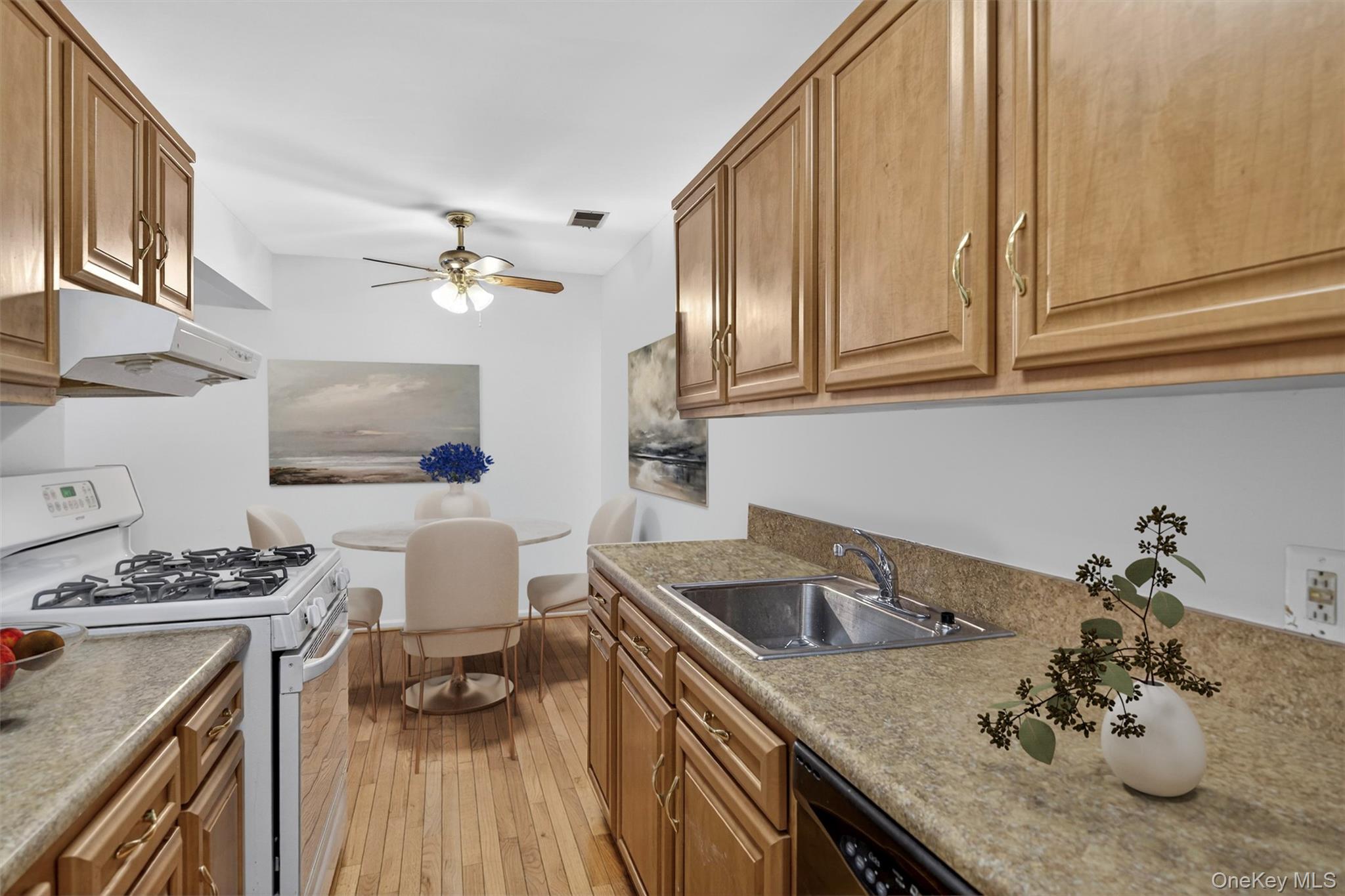 276 Temple Hill Road, Unit 2203 New Windsor, NY 12553 - Photo 11 of 23 Kitchen and dining layout featuring classic cabinetry and easy entertaining space.