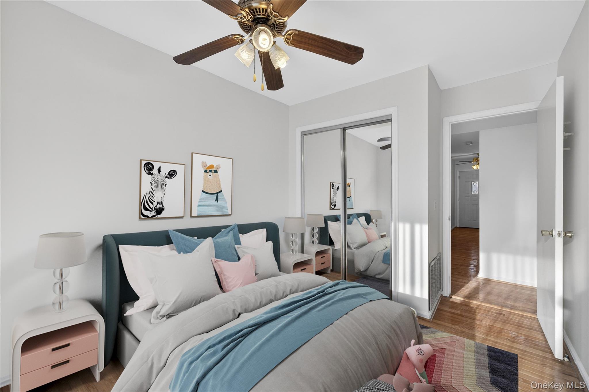 276 Temple Hill Road, Unit 2203 New Windsor, NY 12553 - Photo 14 of 23 Well-sized bedroom featuring hardwood floors and mirrored closet doors.