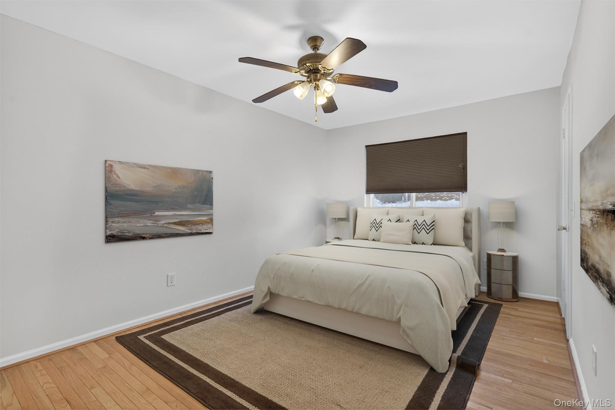 276 Temple Hill Road, Unit 2203 New Windsor, NY 12553 - Photo 16 of 23 Spacious primary bedroom with hardwood floors and ceiling fan.