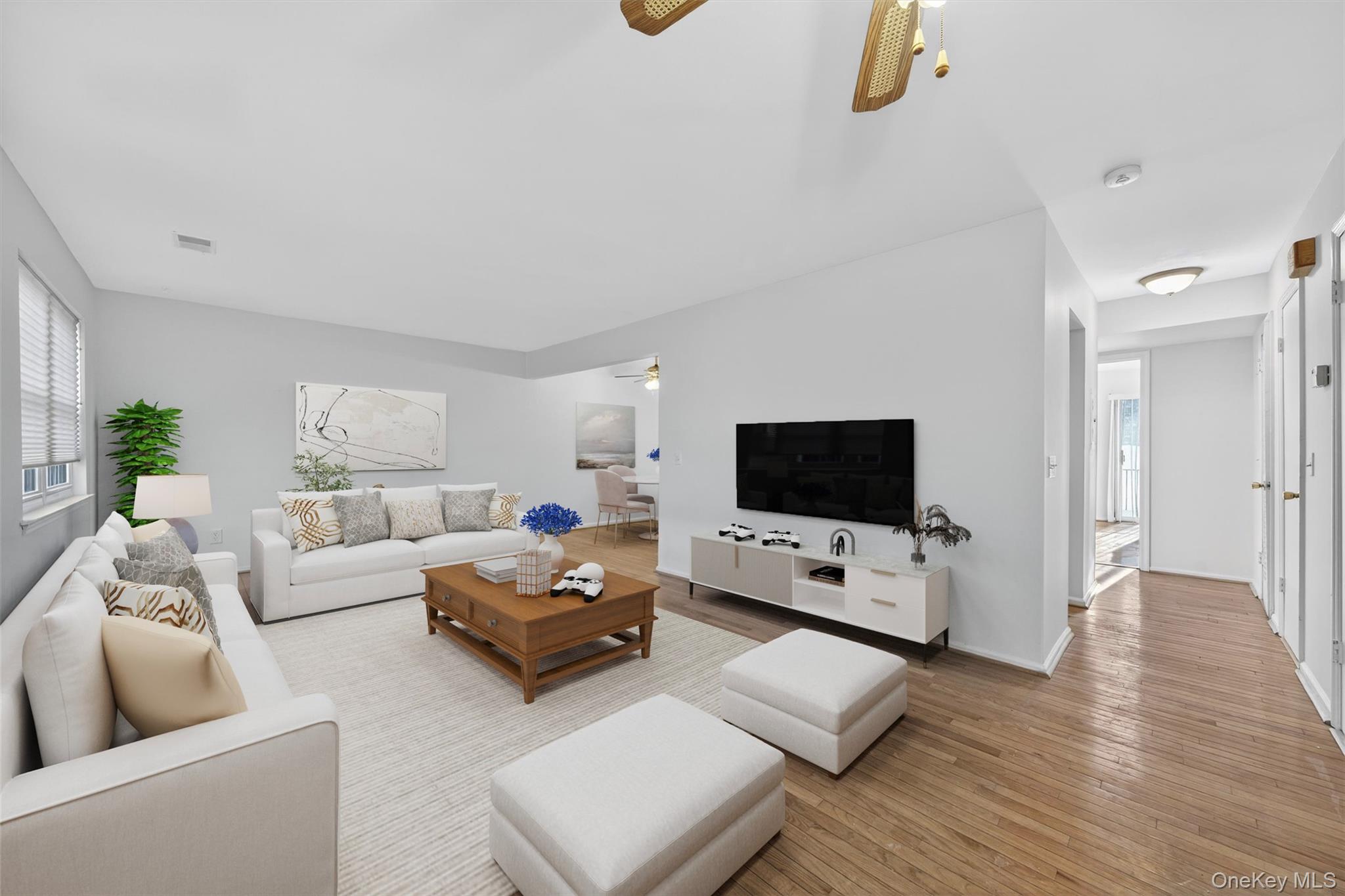 276 Temple Hill Road, Unit 2203 New Windsor, NY 12553 - Photo 4 of 23 Light-filled living area offering generous seating space and neutral finishes.