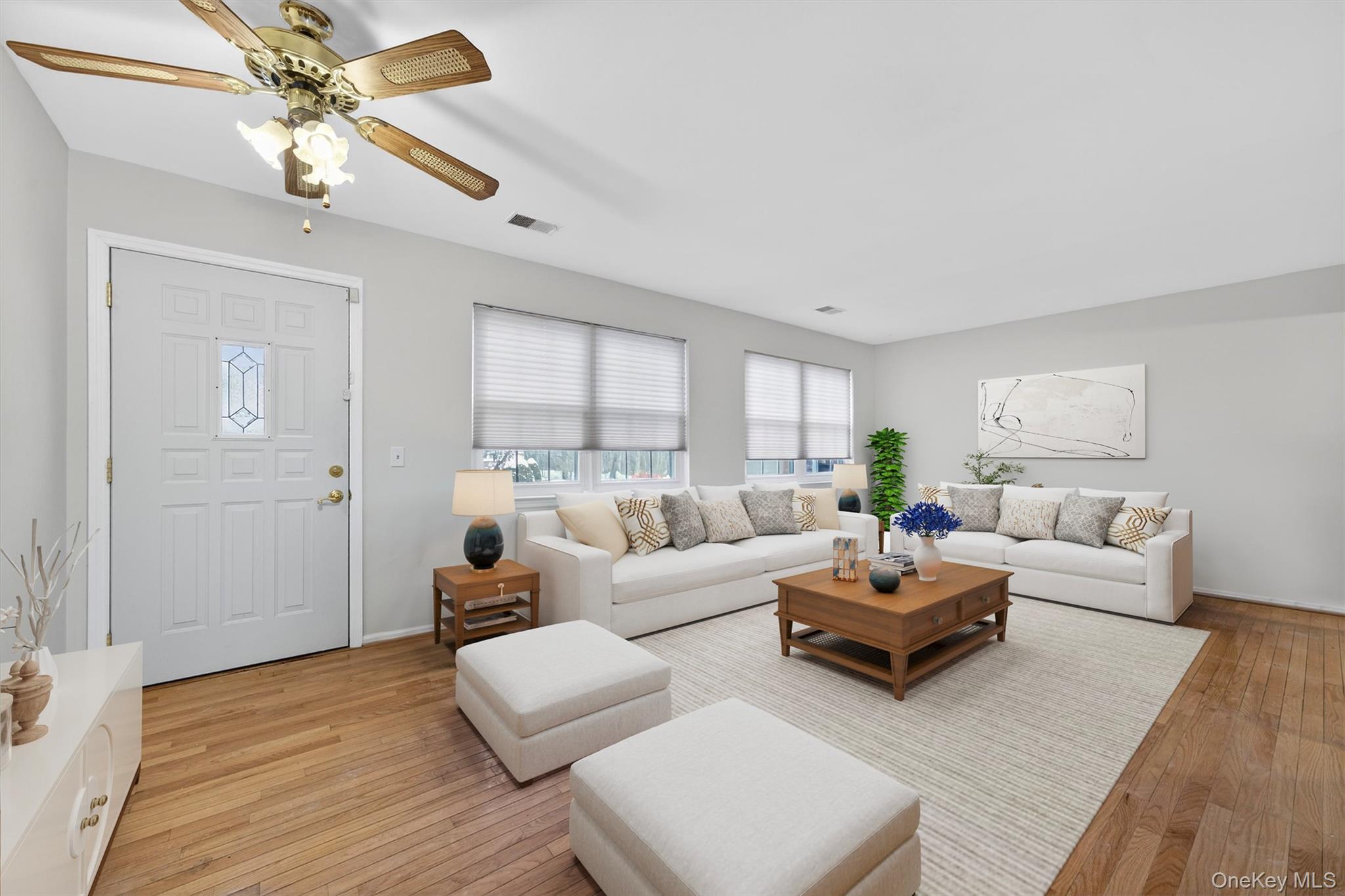 276 Temple Hill Road, Unit 2203 New Windsor, NY 12553 - Photo 5 of 23 Spacious living room with hardwood floors, ceiling fan, and an open, inviting layout.