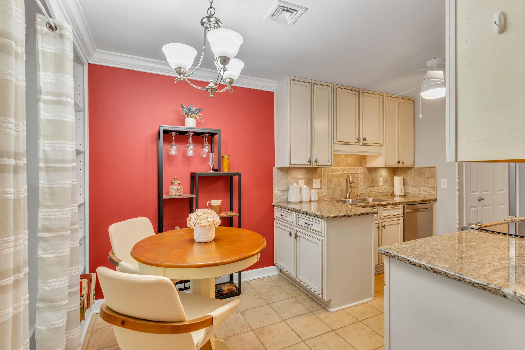 1035 General George Patton Road Nashville, TN 37221 - Photo 11 of 32 a kitchen with stainless steel appliances granite countertop a sink a stove a dining table chairs and a refrigerator