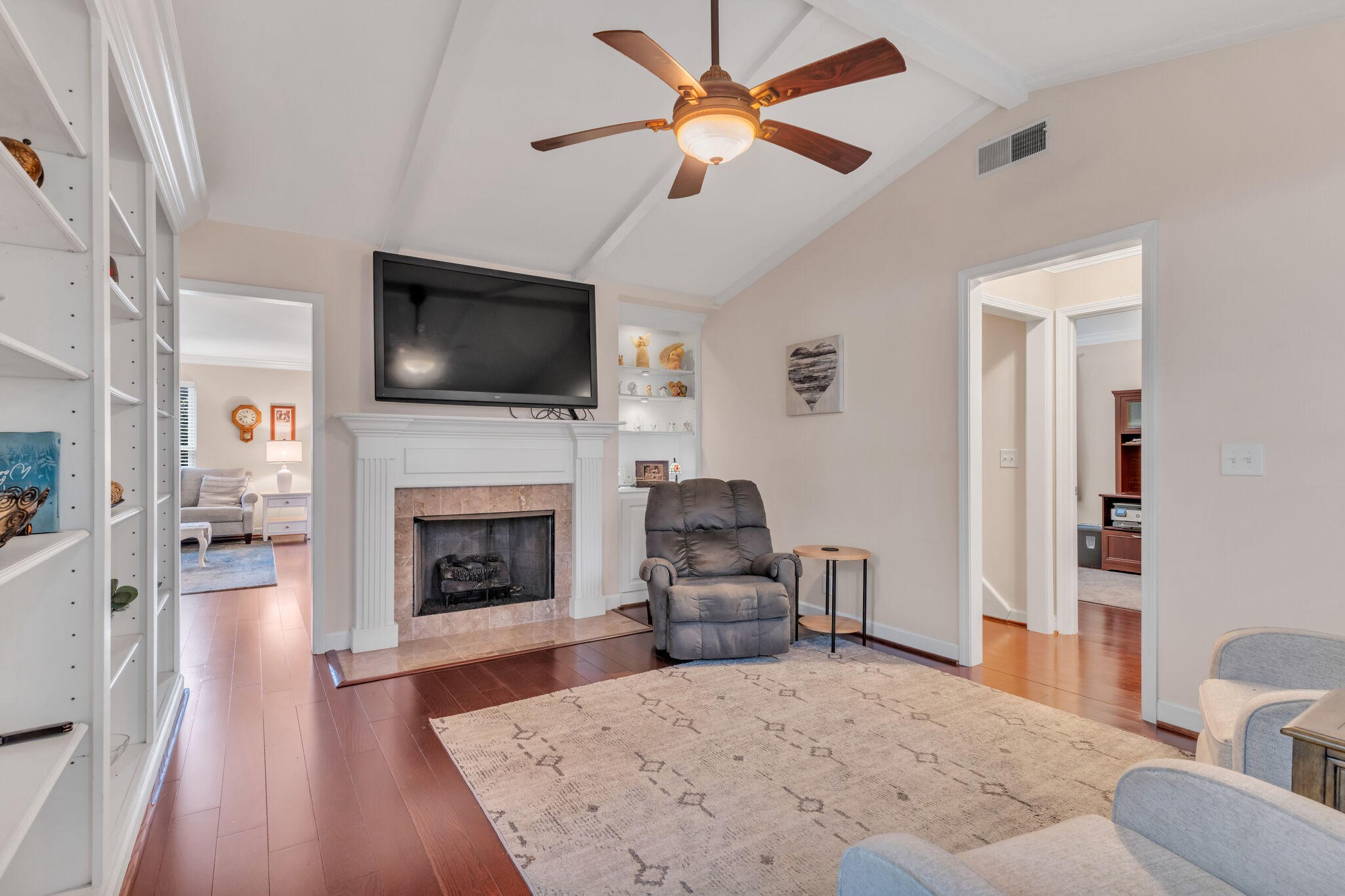 1035 General George Patton Road Nashville, TN 37221 - Photo 13 of 32 a living room with furniture a fireplace and a flat screen tv