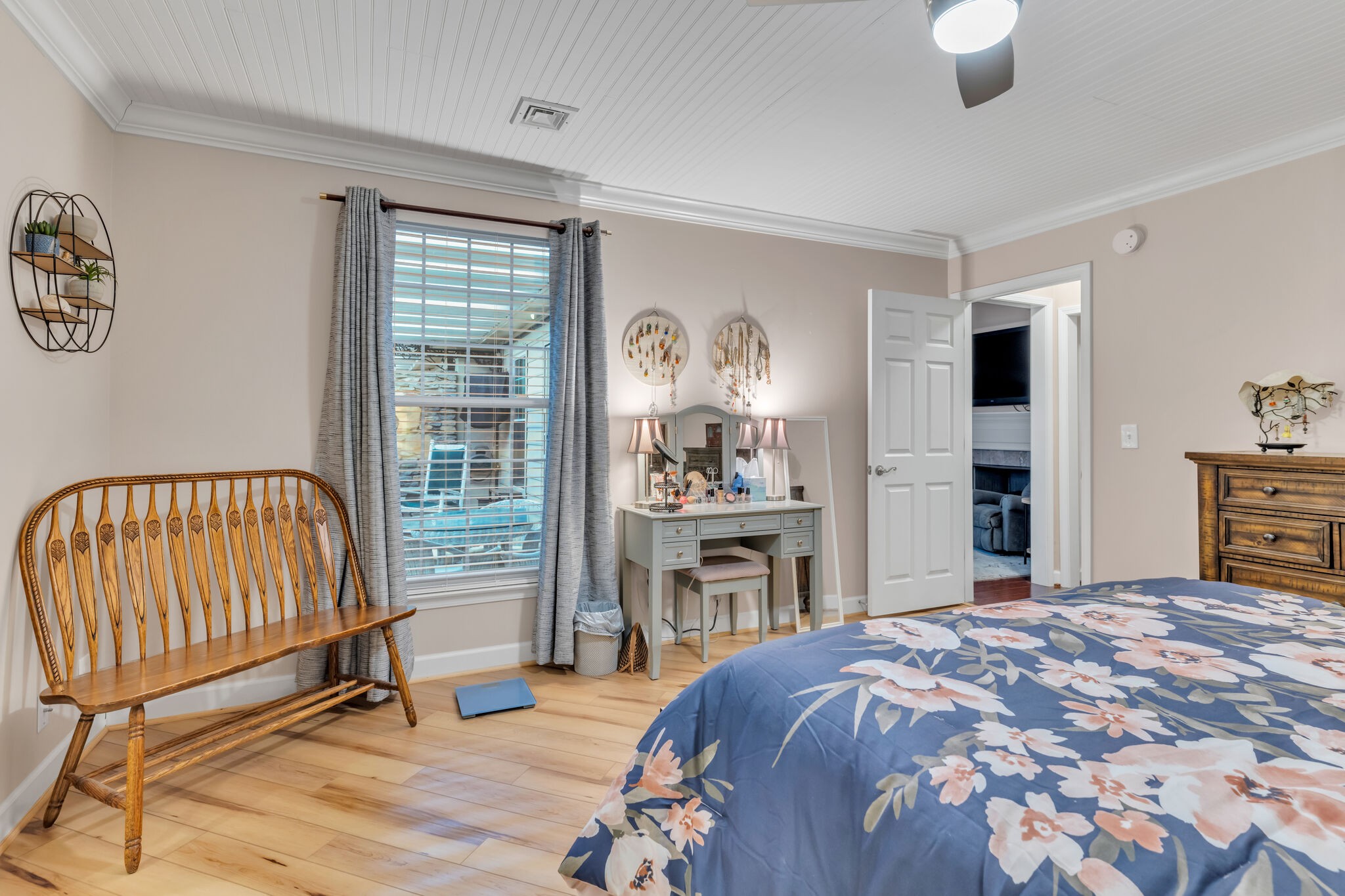 1035 General George Patton Road Nashville, TN 37221 - Photo 17 of 32 a bedroom with a bed and a flat tv screen next to a window