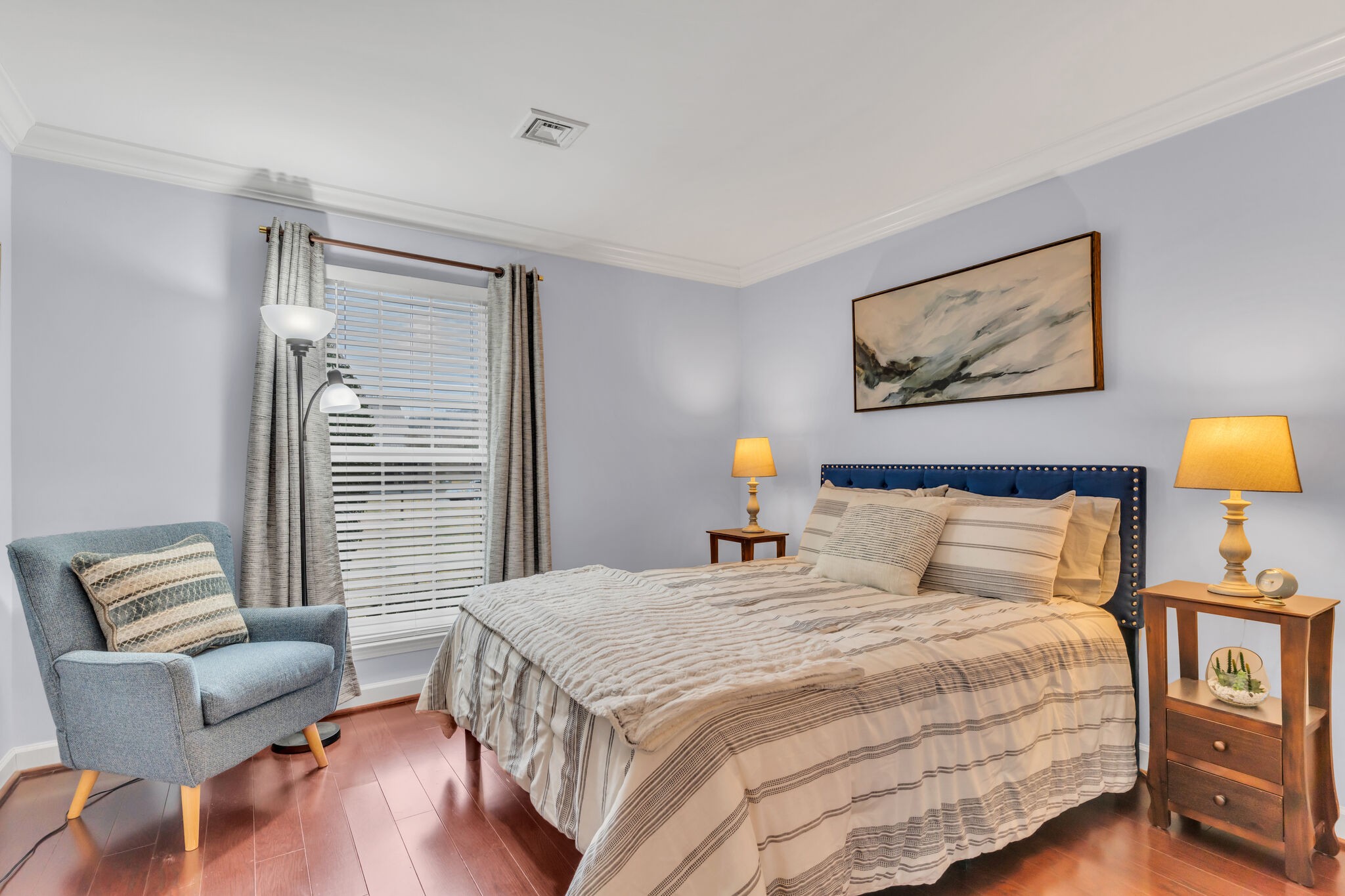 1035 General George Patton Road Nashville, TN 37221 - Photo 23 of 32 a bedroom with a bed and a chair