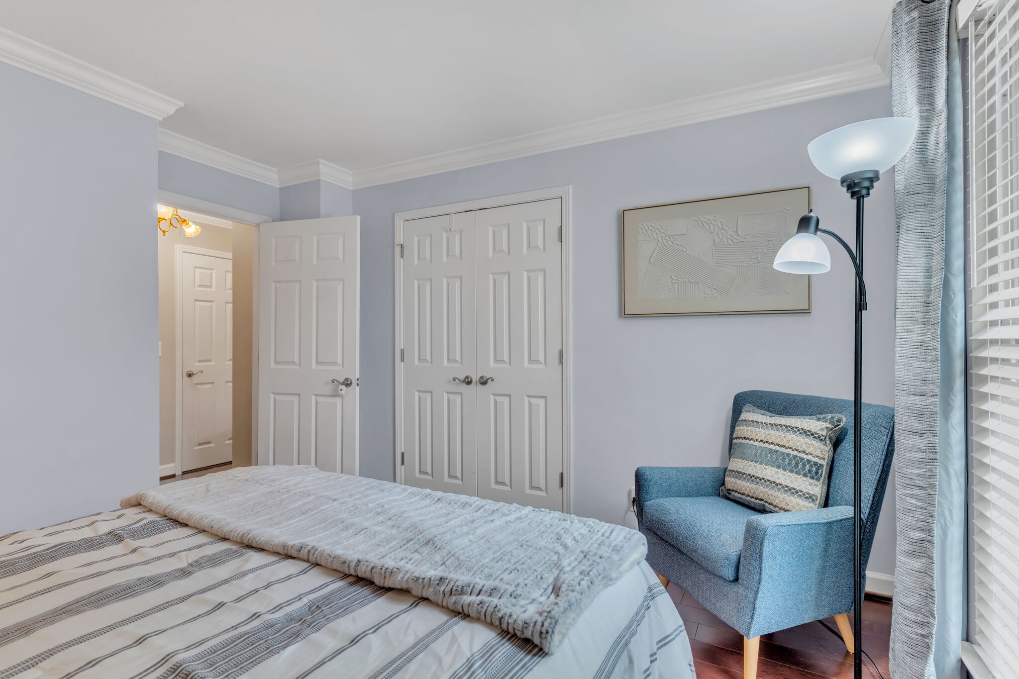 1035 General George Patton Road Nashville, TN 37221 - Photo 24 of 32 a bedroom with a bed and a chair