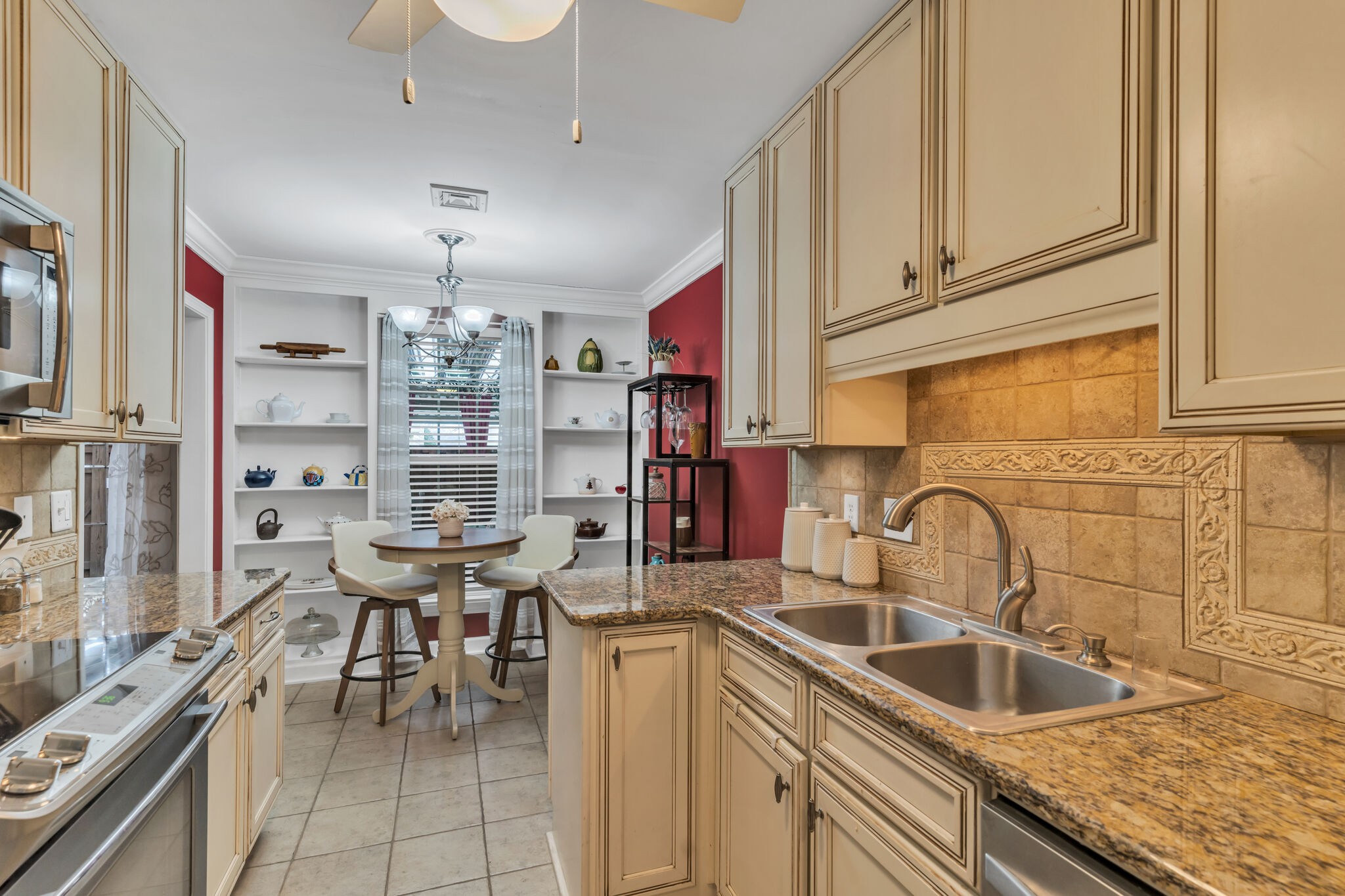 1035 General George Patton Road Nashville, TN 37221 - Photo 10 of 32 a kitchen with stainless steel appliances granite countertop a sink and cabinets