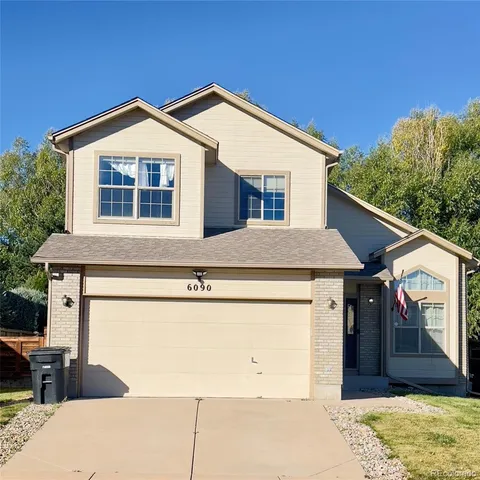 a front view of a house with a garage