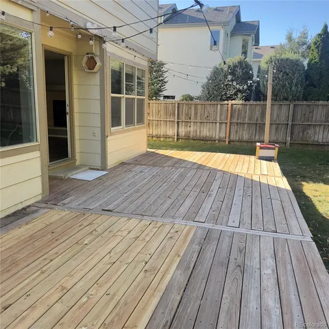 a view of balcony with wooden floor