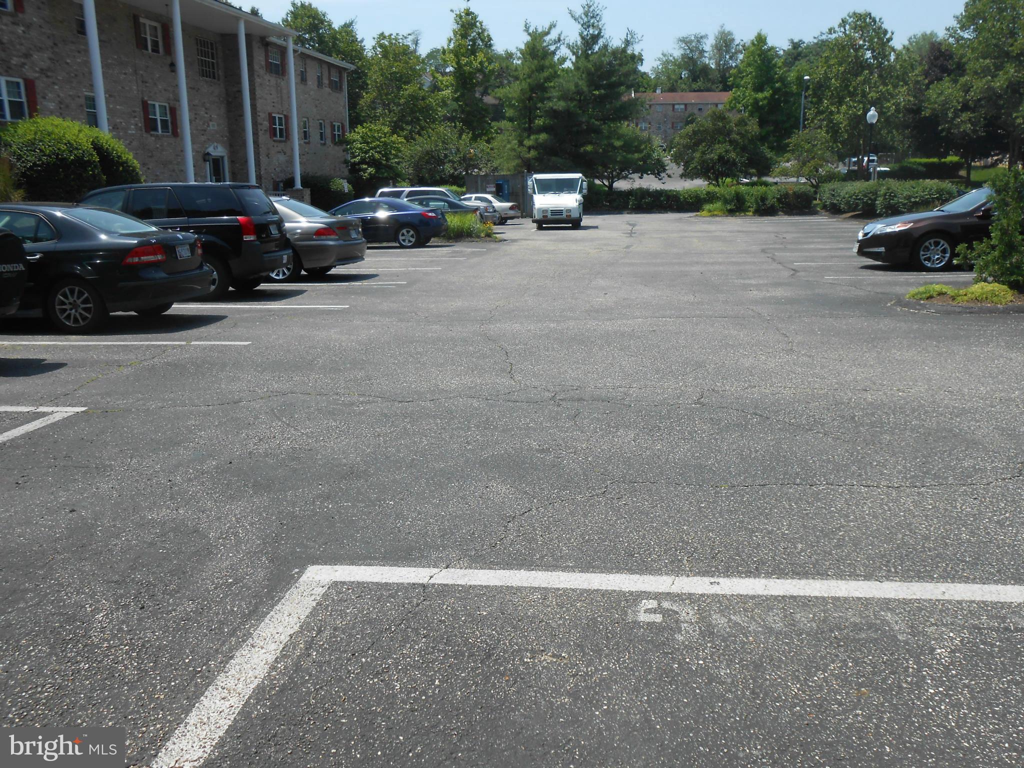 11917 Tarragon Road, Unit I Reisterstown, MD 21136 - Photo 9 of 9 a view of cars parked on the side of a street