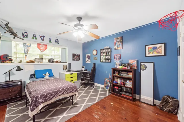 a bedroom with furniture and a chandelier