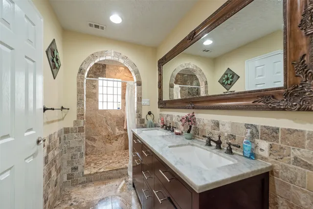 a bathroom with a sink and a mirror