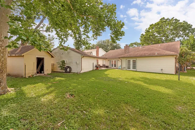 a view of a park with bench and trees