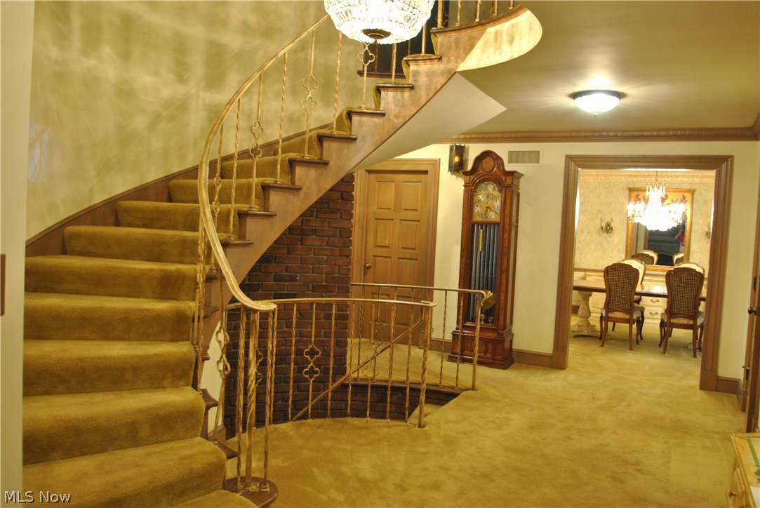 2250 Lancaster Road Akron, OH 44313 - Photo 2 of 35 Exceptional old world craftsmanship makes this a unique home just waiting for your special touches. Foyer showcases a floating staircase.