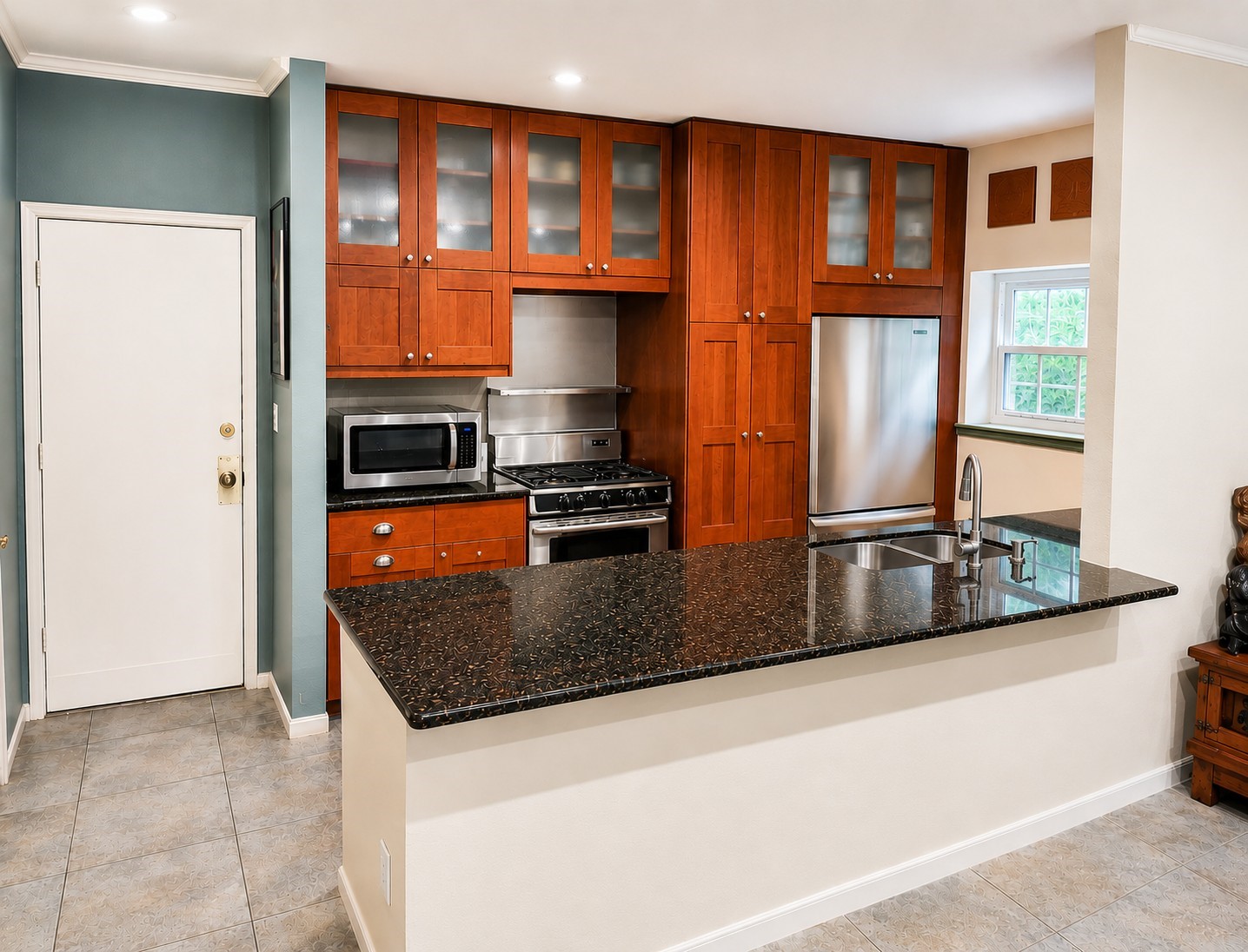 6000 Reims Road, Unit 3601 Houston, TX 77036 - Photo 4 of 13 a kitchen with stainless steel appliances granite countertop a sink stove and a refrigerator